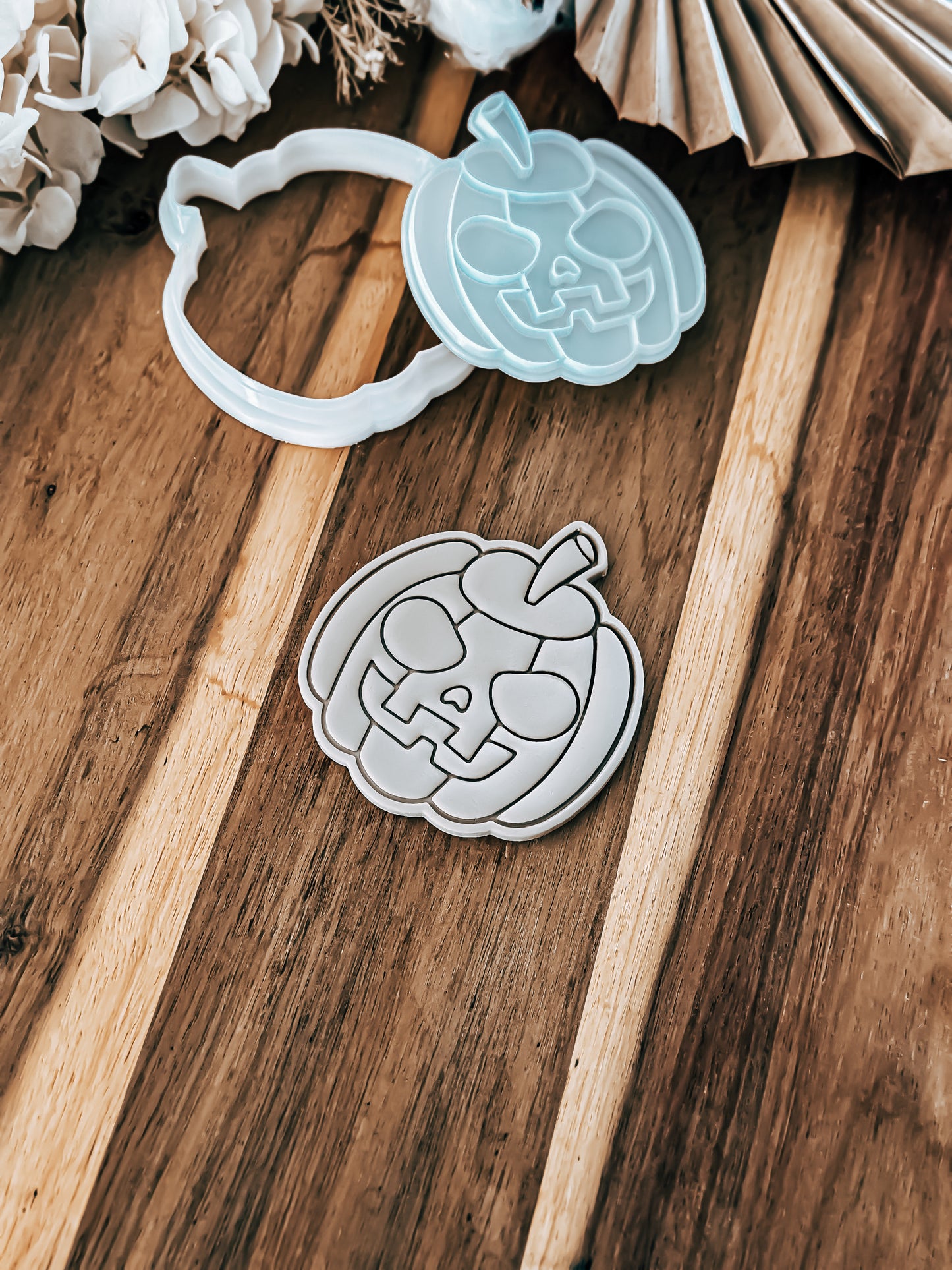 Scary Pumpkin Halloween cookie stamp and cutter by O'Khach, shown stamped in fondant
