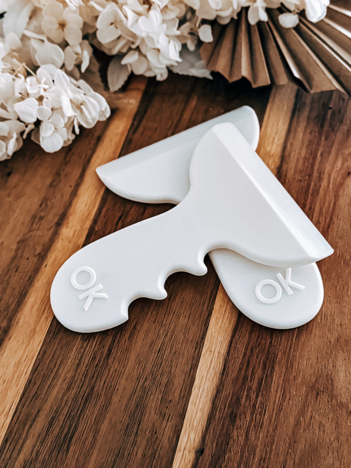 Large 10cm Signature Fondant Scraper beside the embossed OK logo handle of another O'Khach scraper