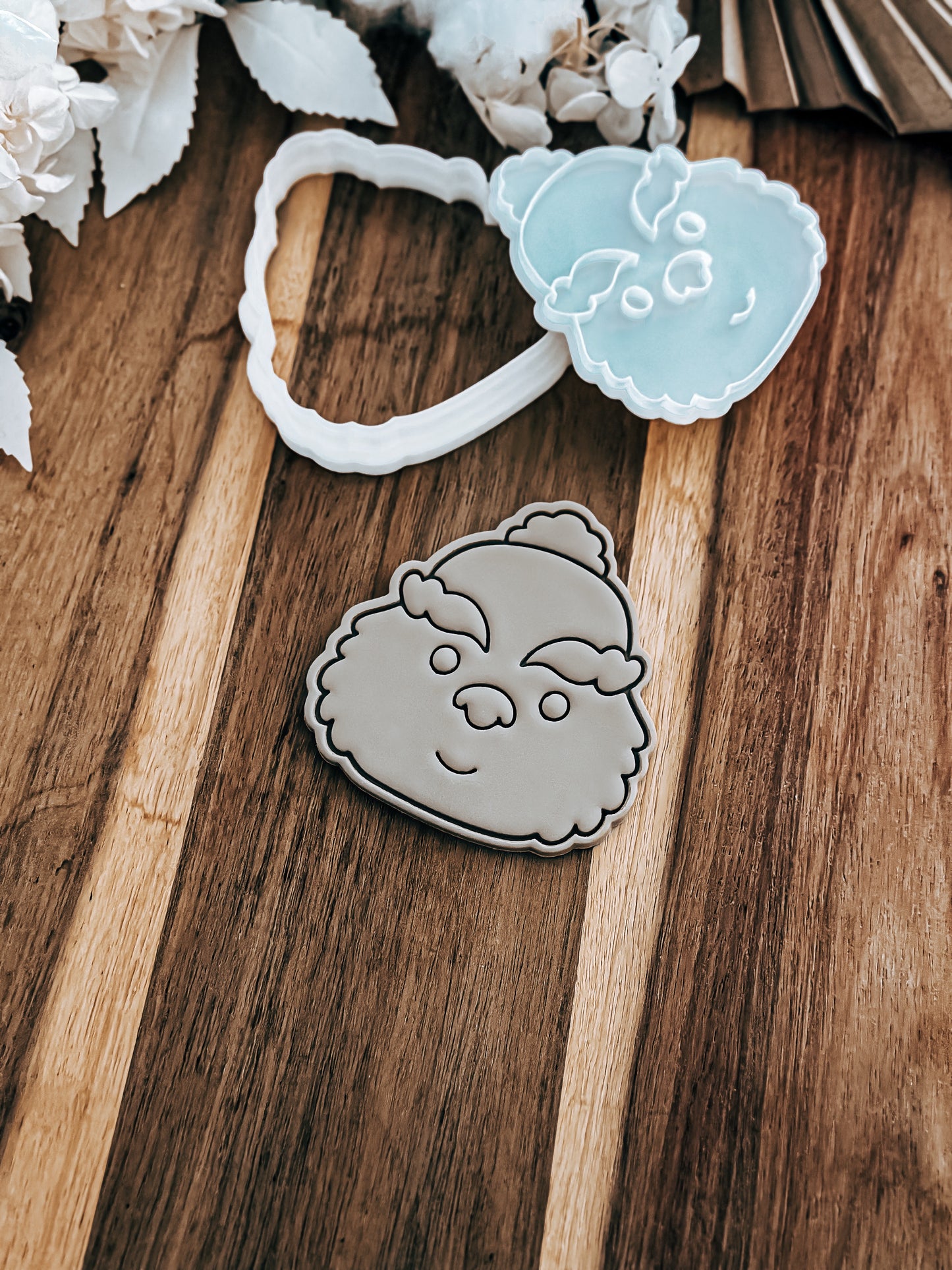 Christmas Grump (Simple) cookie stamp and cutter by O'Khach, shown stamped in fondant