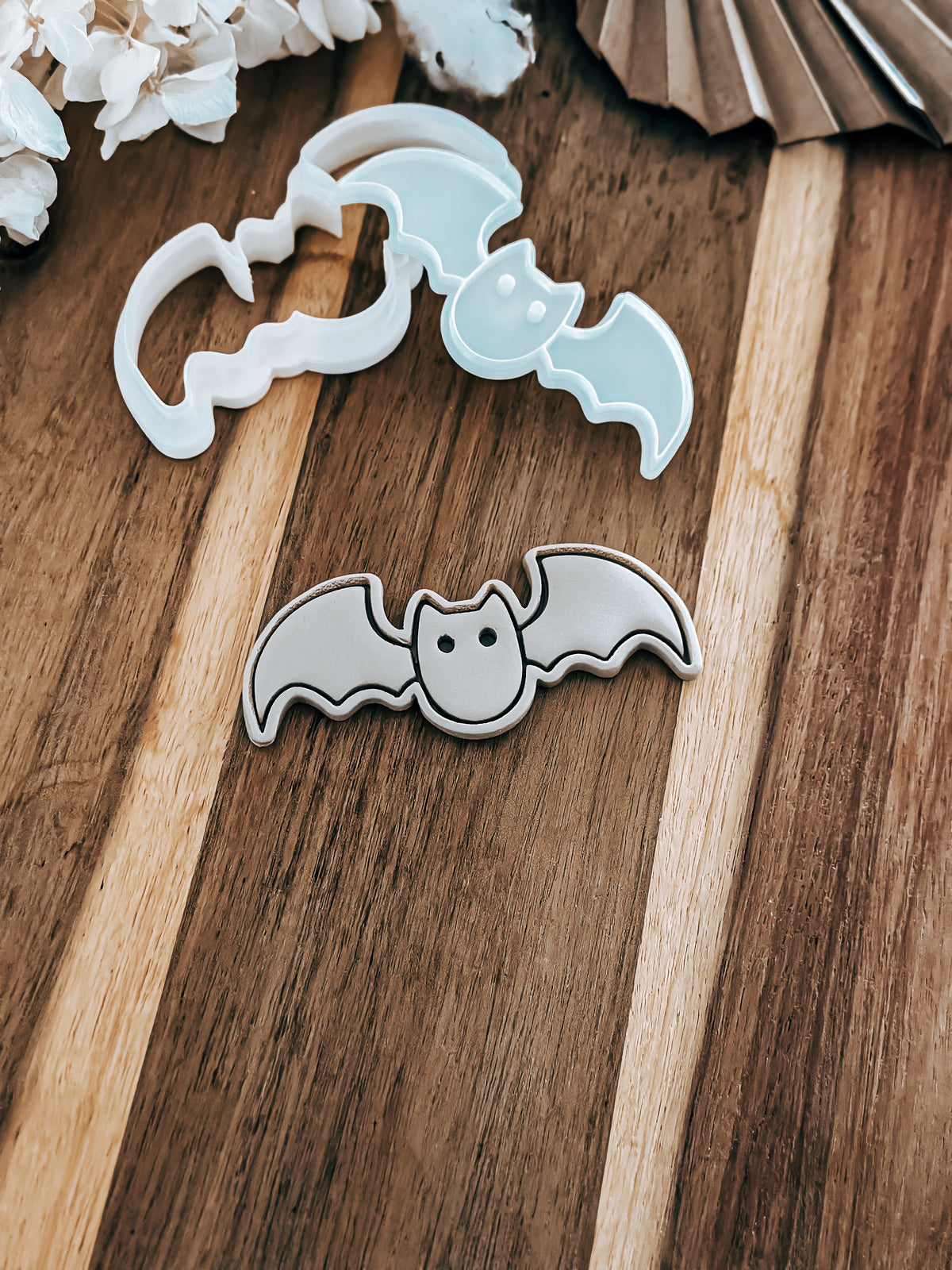 Bat Halloween cookie stamp and cutter by O'Khach, shown stamped in fondant