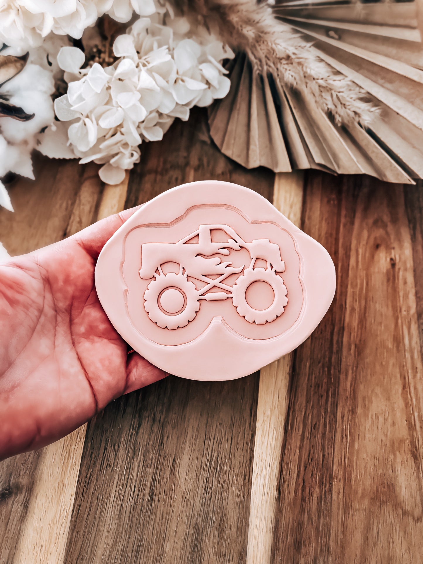 Monster Truck 'UP' cookie stamp and cutter by O'Khach, shown stamped in fondant
