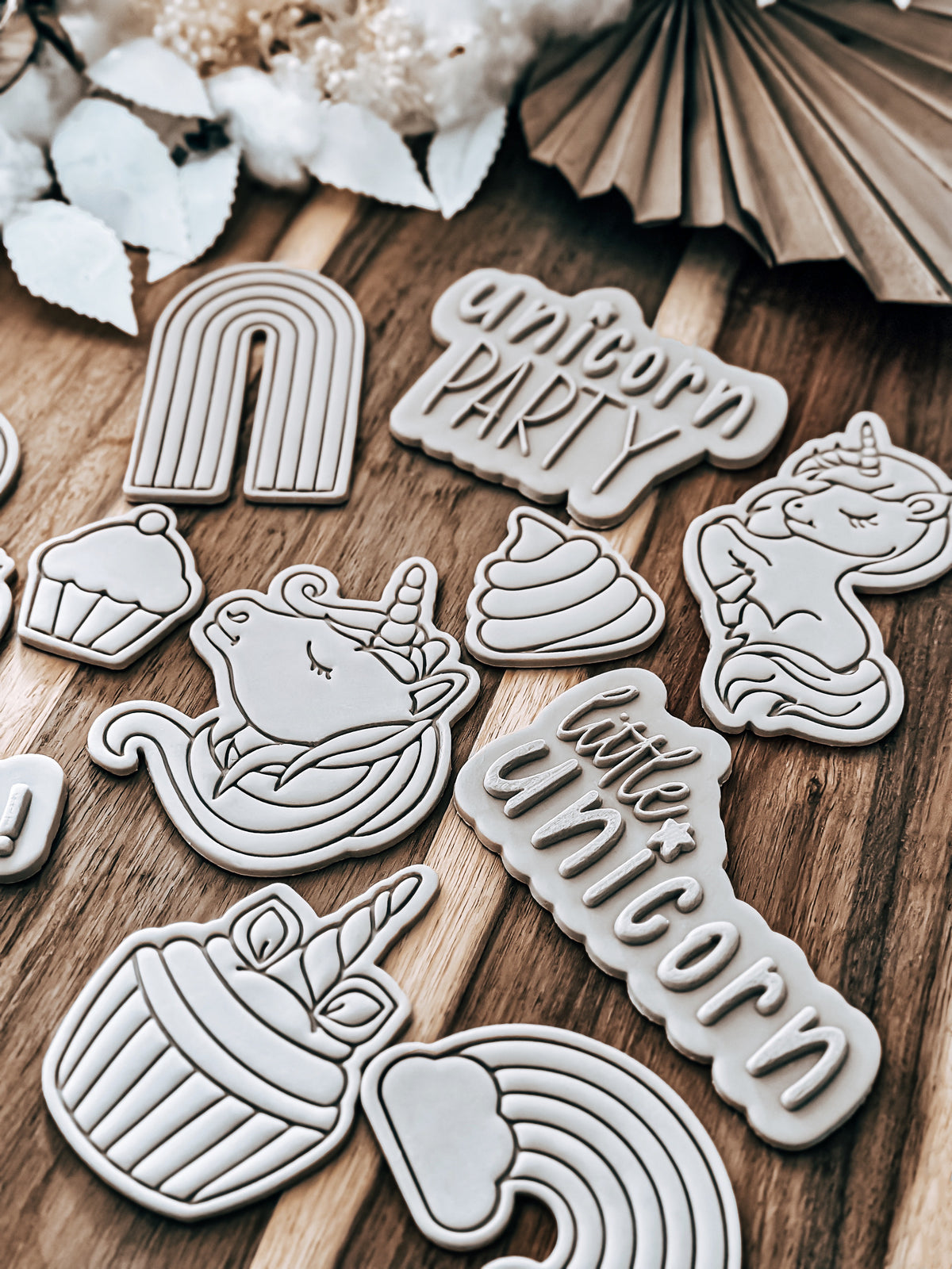 Little Unicorn 'UP' design stamped in fondant to show the finished cookie