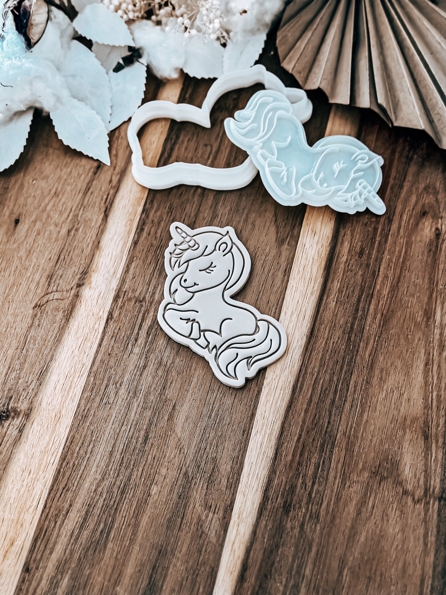 Full Unicorn (Glitter) cookie stamp and cutter by O'Khach, shown stamped in fondant