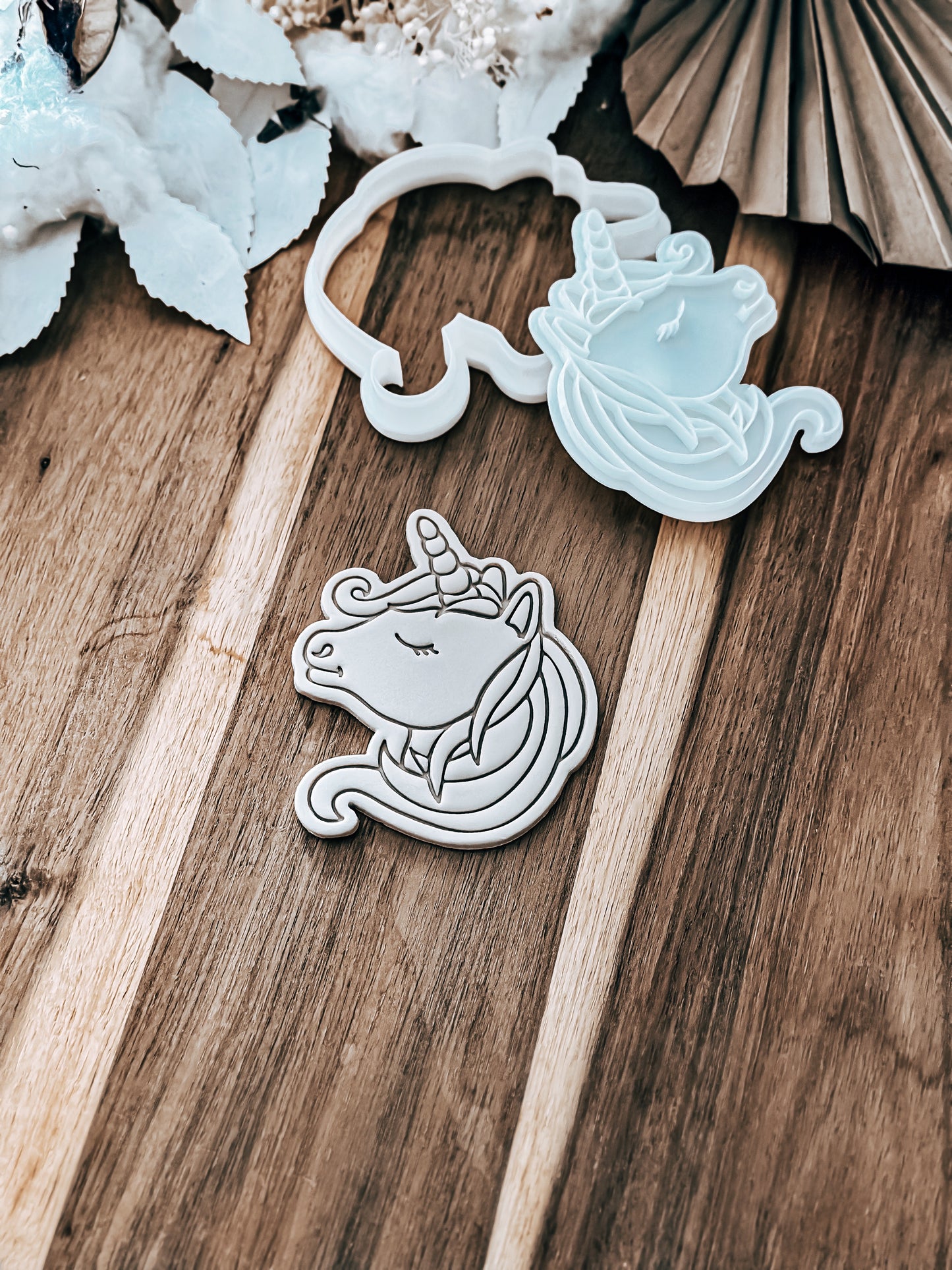 Unicorn cookie stamp and cutter by O'Khach, shown stamped in fondant