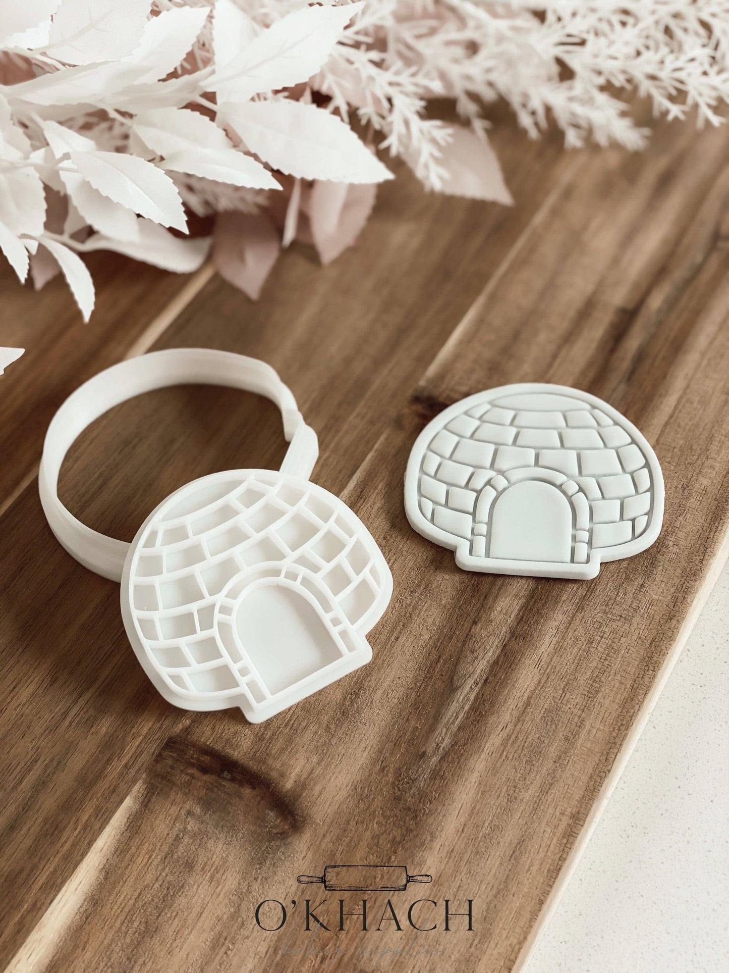 Igloo Christmas cookie stamp and cutter by O'Khach, shown stamped in fondant