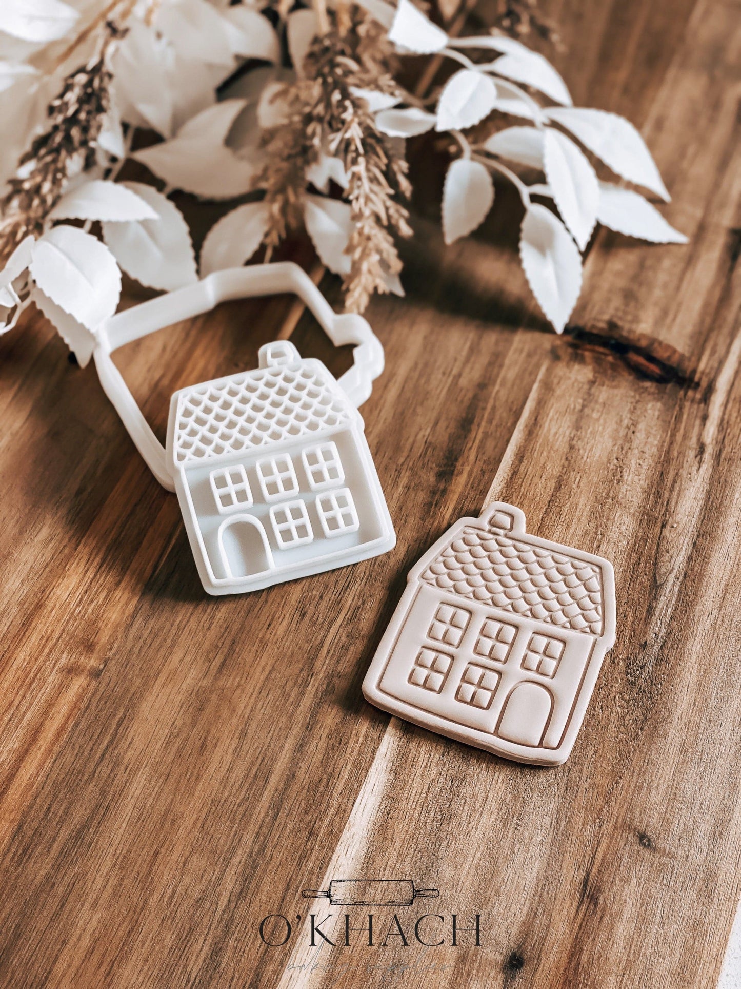 Roof House Christmas cookie stamp and cutter by O'Khach, shown stamped in fondant