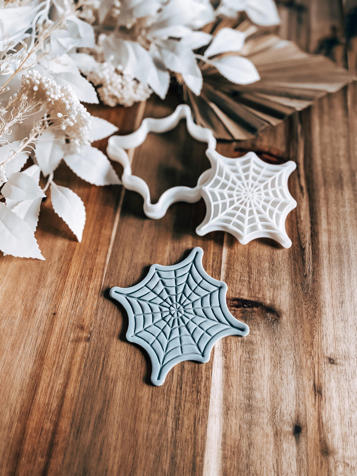 Full Web Halloween cookie stamp and cutter by O'Khach, shown stamped in fondant