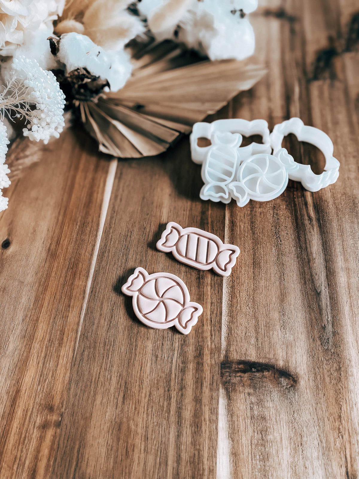 Mini Candies (Set Of 2) Christmas cookie stamp and cutter by O'Khach, shown stamped in fondant