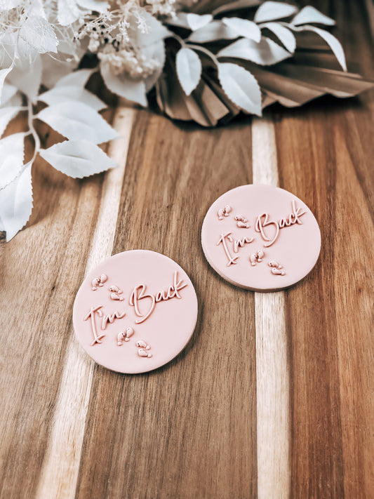 I'm Back 'UP' design stamped in fondant to show the finished cookie