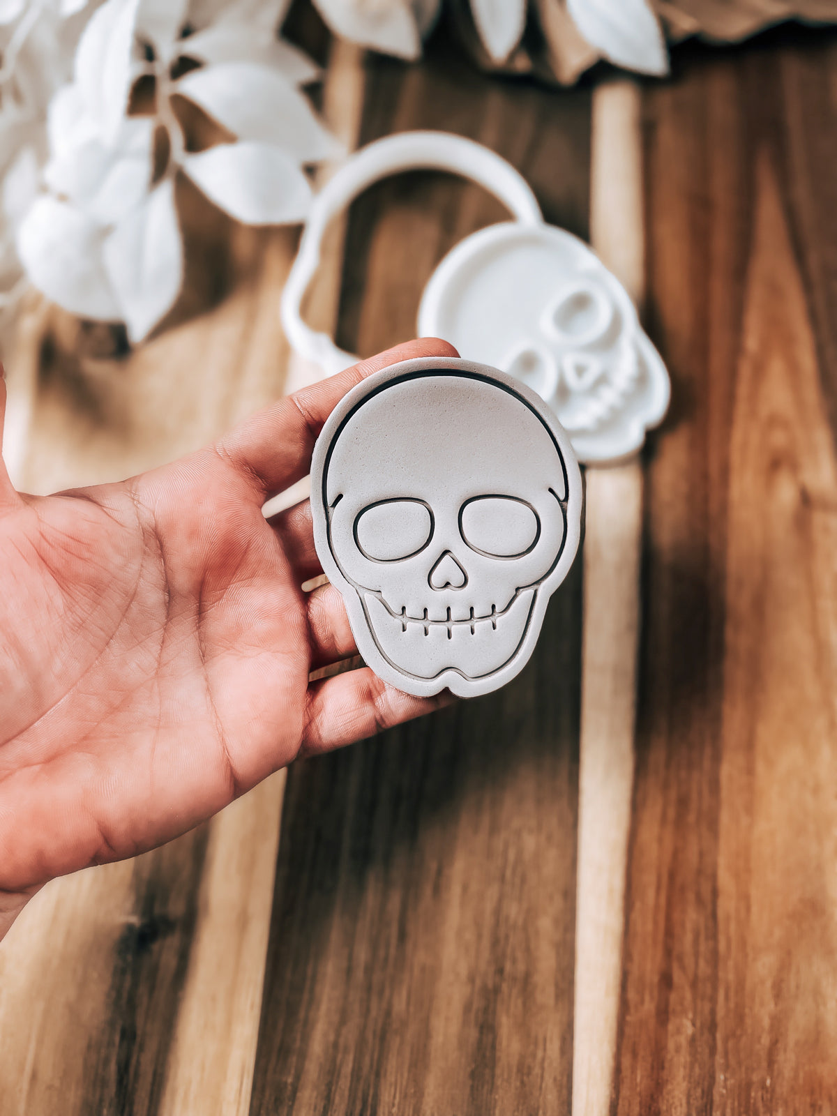 Skull Halloween cookie stamp and cutter by O'Khach, shown stamped in fondant