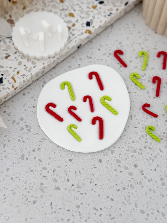 Red and green fondant candy canes made with the Two Tone Press mould by O'Khach Baking Supplies