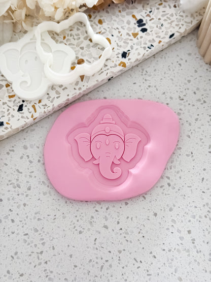 Ganesha elephant cookie stamp and cutter by O'Khach, shown stamped in pink fondant