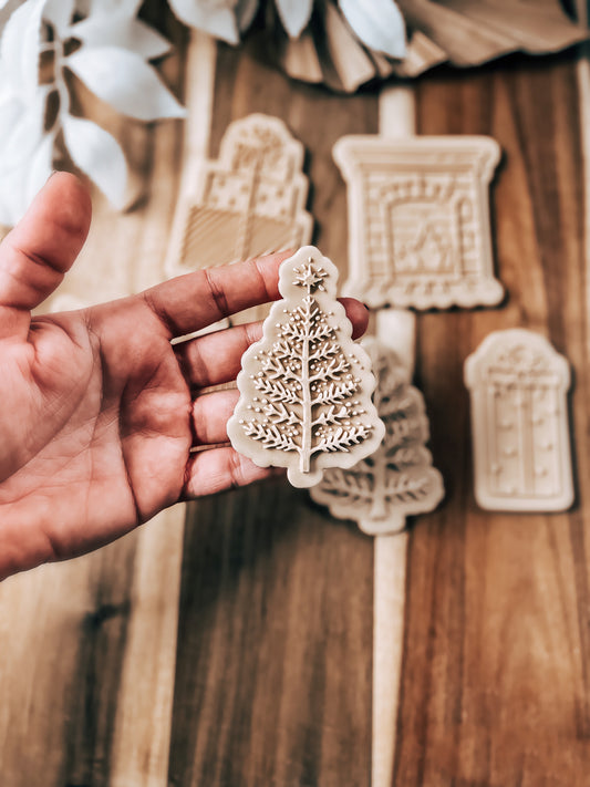 Snowy Christmas Tree 'UP' cookie stamp and cutter by O'Khach, shown stamped in fondant